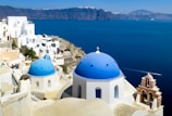 white and blue dome building near body of water during daytime